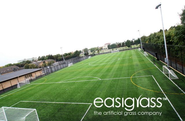 aerial photo of fake grass football pitches