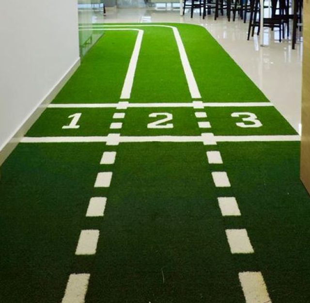 indoor artificial grass installation with running track markings