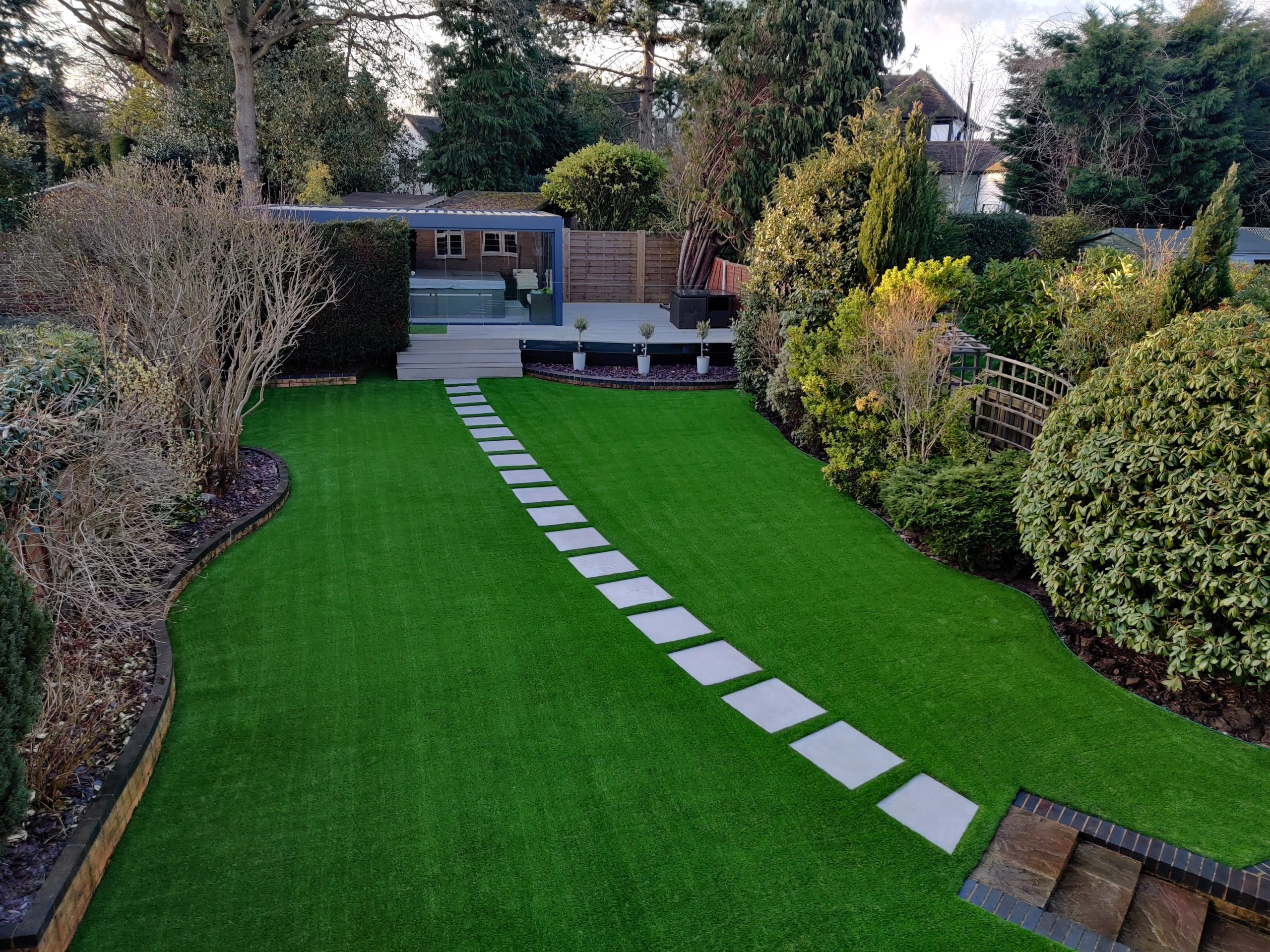 completed artificial grass installation in large back garden
