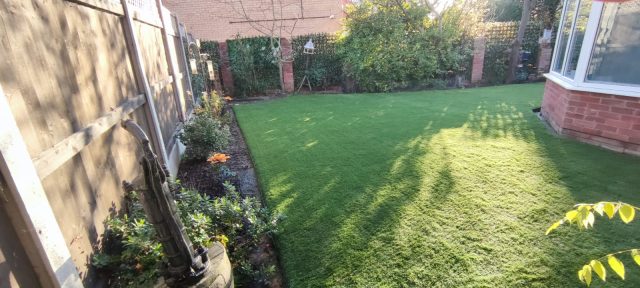 artificial grass installation in back garden in Colchester, Essex